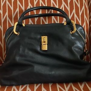 Marc Jacobs black and gold leather bag.